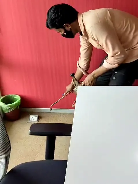 Treating beneath a desk in an office